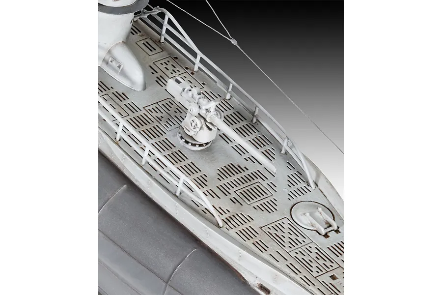 Close-up of the deck of a 1/144 scale U-boat model, showing the deck gun, railings, and textured deck plating.