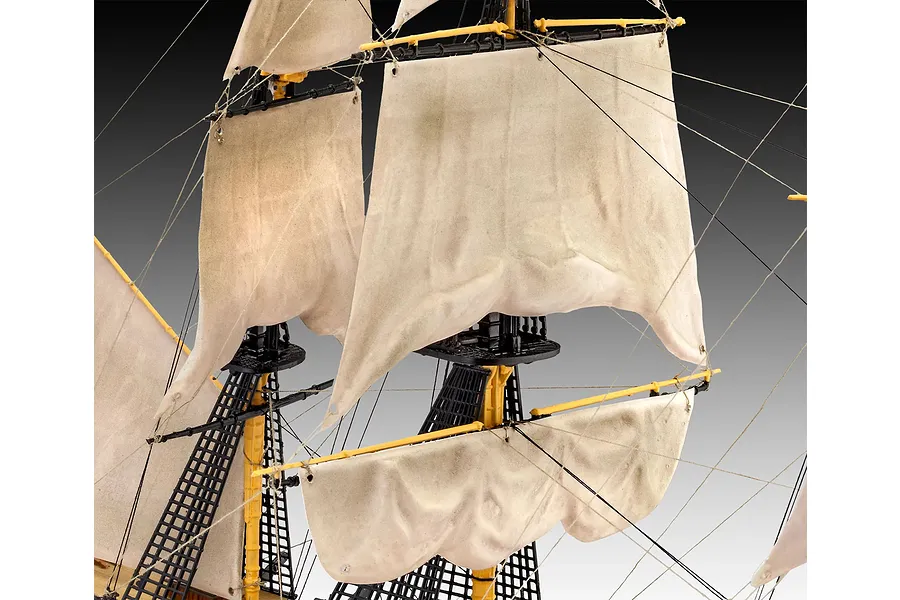 Close-up of the masts, rigging, and fabric sails on a Revell HMS Victory plastic model ship kit.