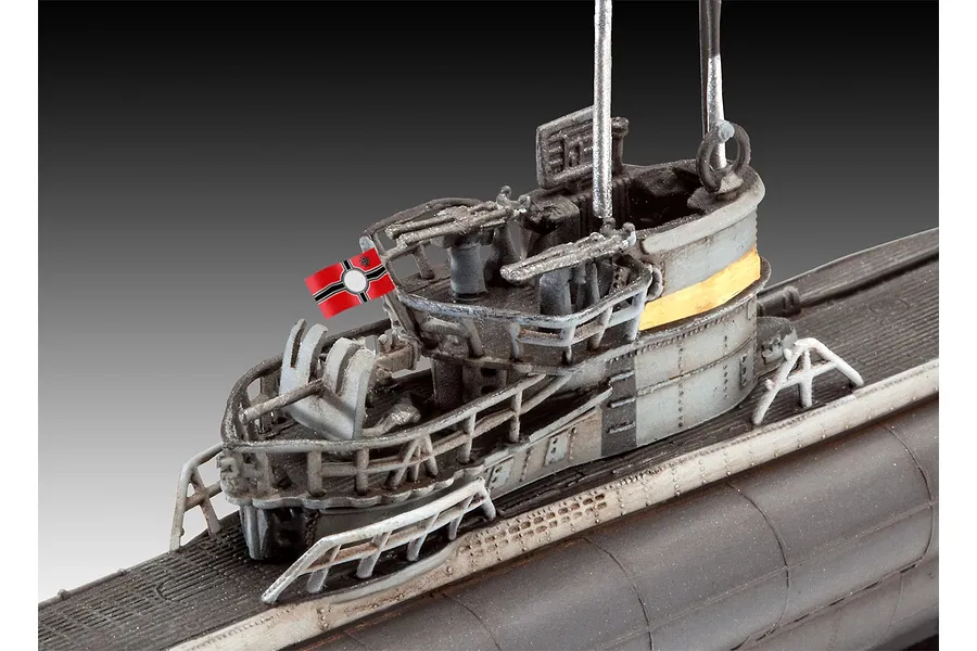 Close-up of the conning tower of a 1/350 scale Revell German Type VII C/41 submarine model, showing detailed railings, deck guns, and a small flag.