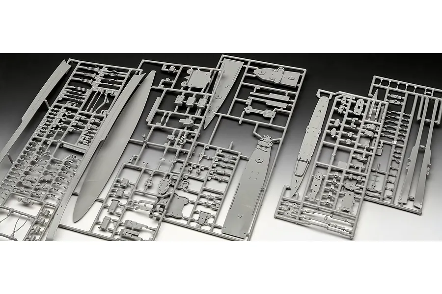 Three grey plastic model kit sprues containing various ship parts for a 1/700 scale model set.