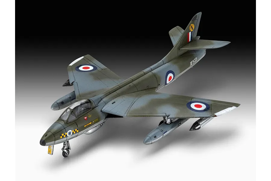 A completed 1/144 scale plastic model of a Hawker Hunter FGA.9 jet fighter, painted in camouflage with RAF markings.