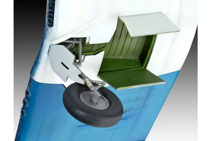 Close-up of the landing gear assembly on a painted plastic model of a Vought F4U-1A Corsair aircraft.