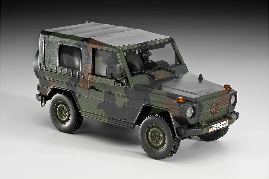 A fully assembled and painted 1/35 scale plastic model of a German military Wolf truck in camouflage paint.
