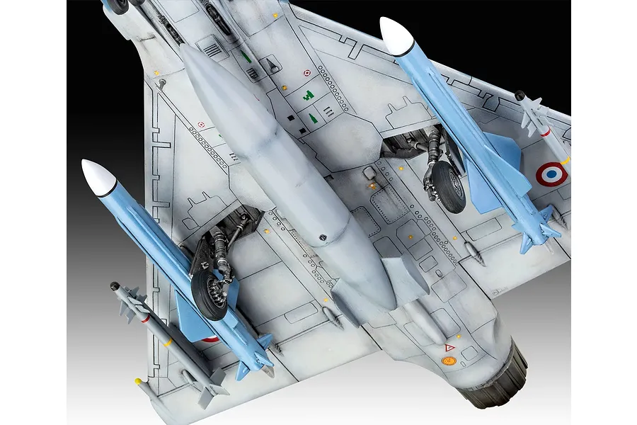 Underside view of a detailed 1/48 scale plastic model of a Dassault Mirage 2000 C fighter jet, showing landing gear, missiles, and fuel tank.
