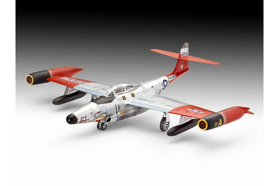 A completed 1/72 scale plastic model of a Northrop F-89 Scorpion jet fighter, featuring a silver and red paint scheme with shark mouth nose art.