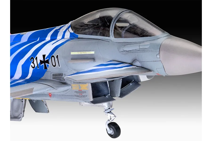 A close-up view of a 1/72 scale plastic model of a Eurofighter Typhoon with Bavarian Tiger 2021 livery, showing the cockpit and nose section.