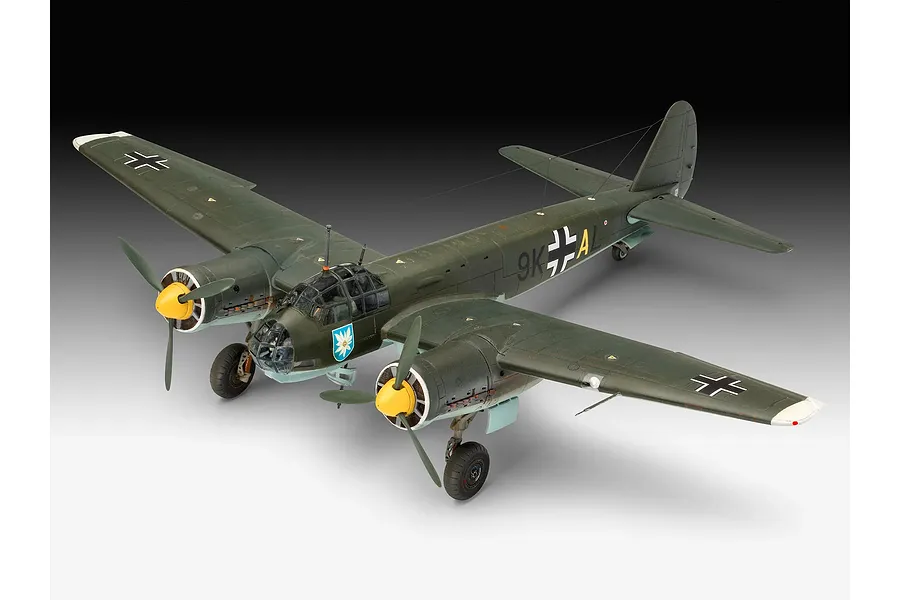 A fully assembled and painted 1/72 scale plastic model of a Junkers Ju 88 A-1 bomber, featuring dark green camouflage and yellow propeller spinners.