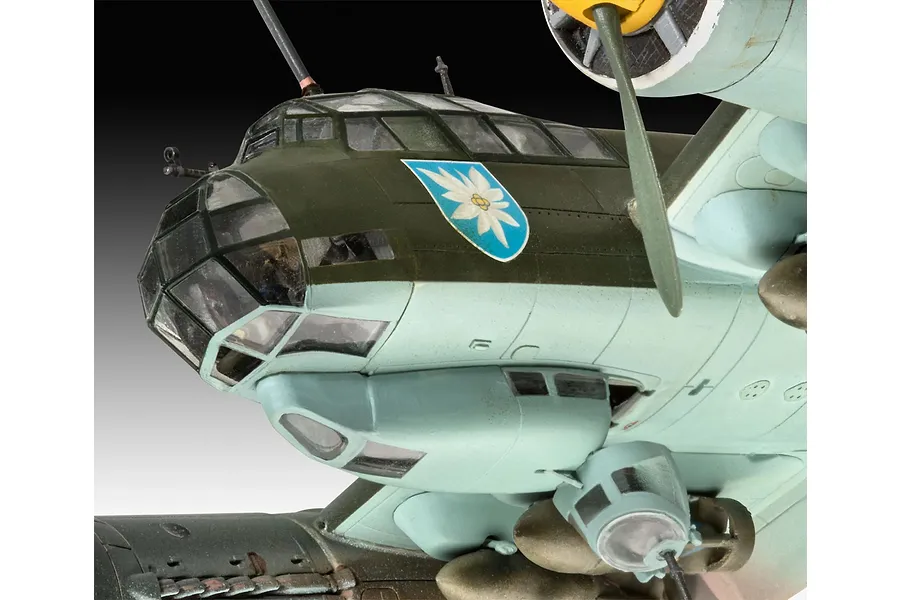 Close-up of a 1/72 scale Junkers Ju88 A-1 model aircraft showing the cockpit, nose section, and an edelweiss emblem on the fuselage.