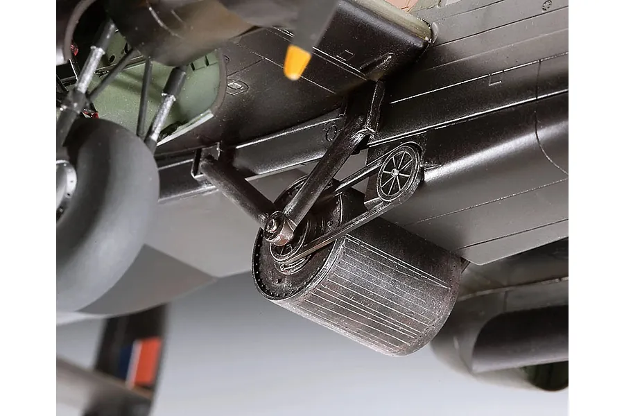 Close-up of the underside of a 1/72 scale Lancaster model showing the rotating bomb mechanism and landing gear.