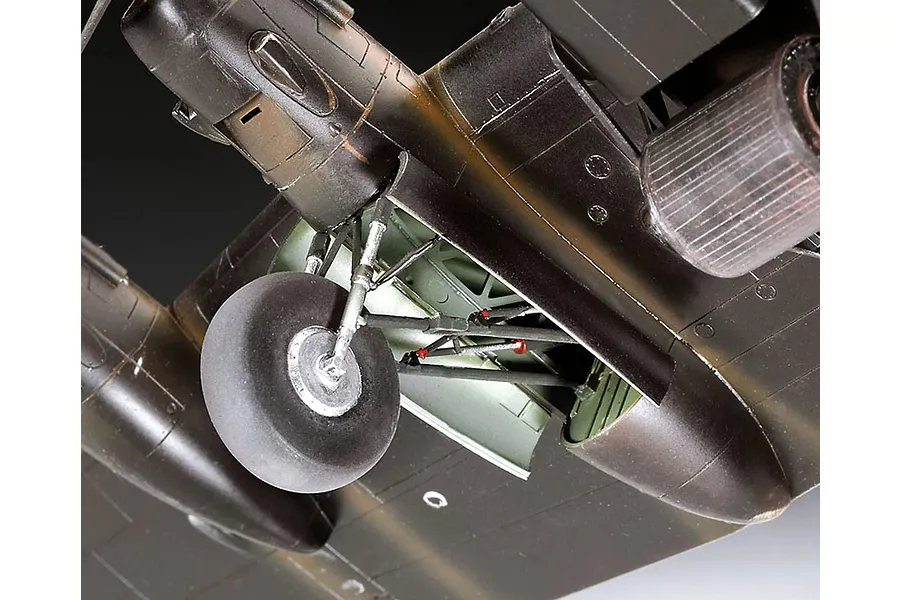 Close-up view of the landing gear and wheel well of a scale model Lancaster bomber, showing detailed mechanical parts and painted surfaces.