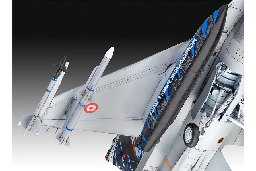 Close-up of a 1/72 scale plastic model F-16D fighter jet showing the underside of the wing, missiles, and landing gear.