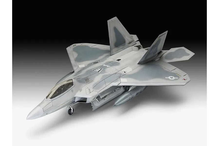 A fully assembled and painted 1/72 scale plastic model of a Lockheed Martin F-22A Raptor fighter jet, shown from a high-angle perspective.