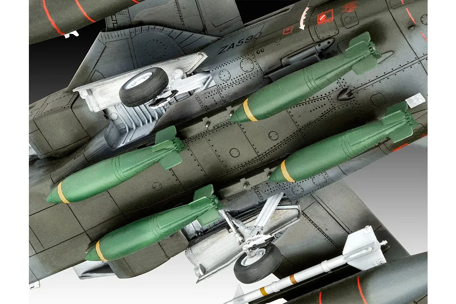 Underside view of a detailed plastic model Panavia Tornado aircraft showing landing gear and green bomb payloads.