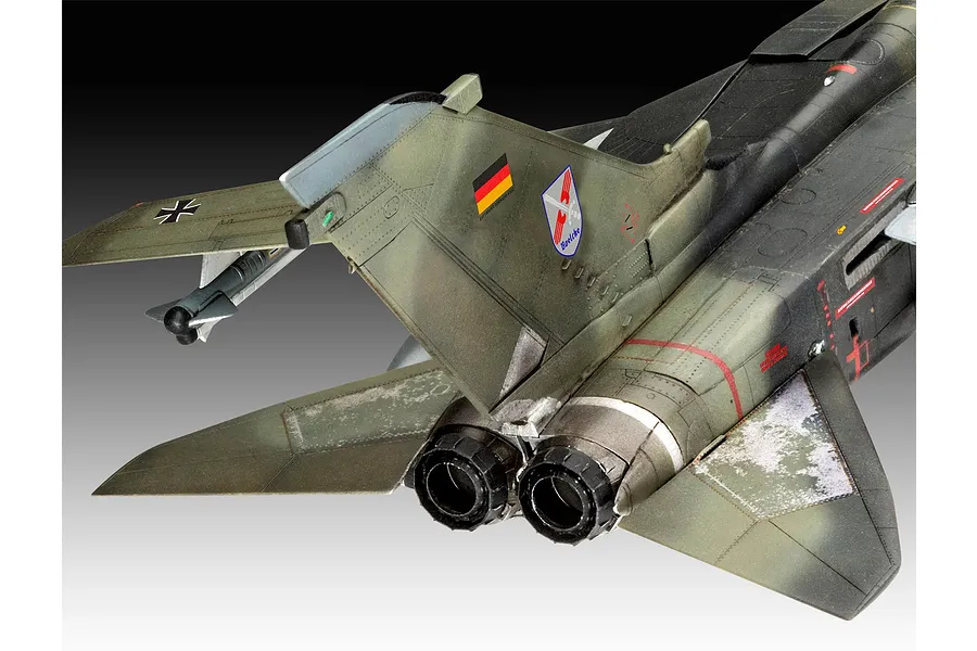 Close-up rear view of a 1/72 scale Panavia Tornado model aircraft showing the twin engine exhausts, vertical stabilizer, and camouflage paint scheme.