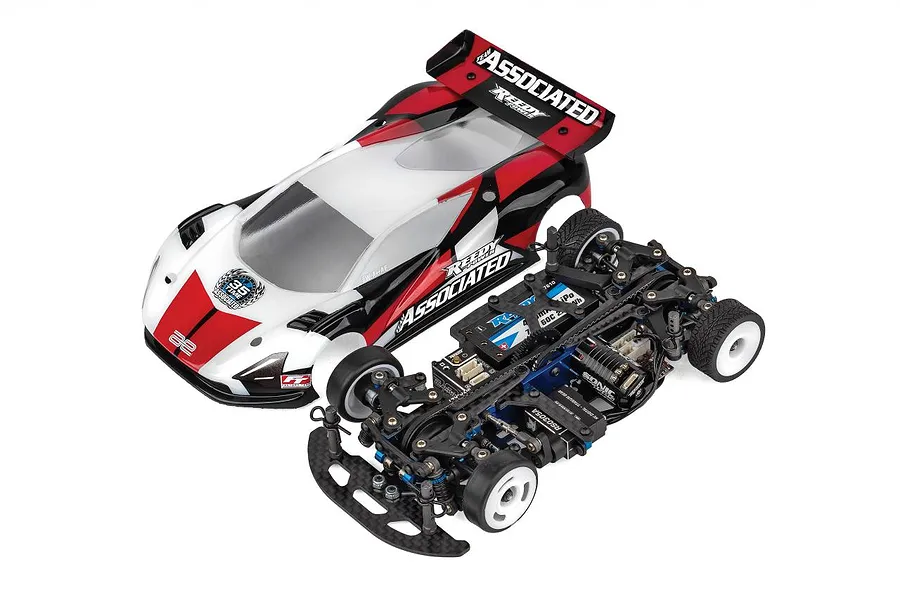 Team Associated TC28 1/28 scale RC touring car kit shown with its painted body shell removed to reveal the internal chassis components.