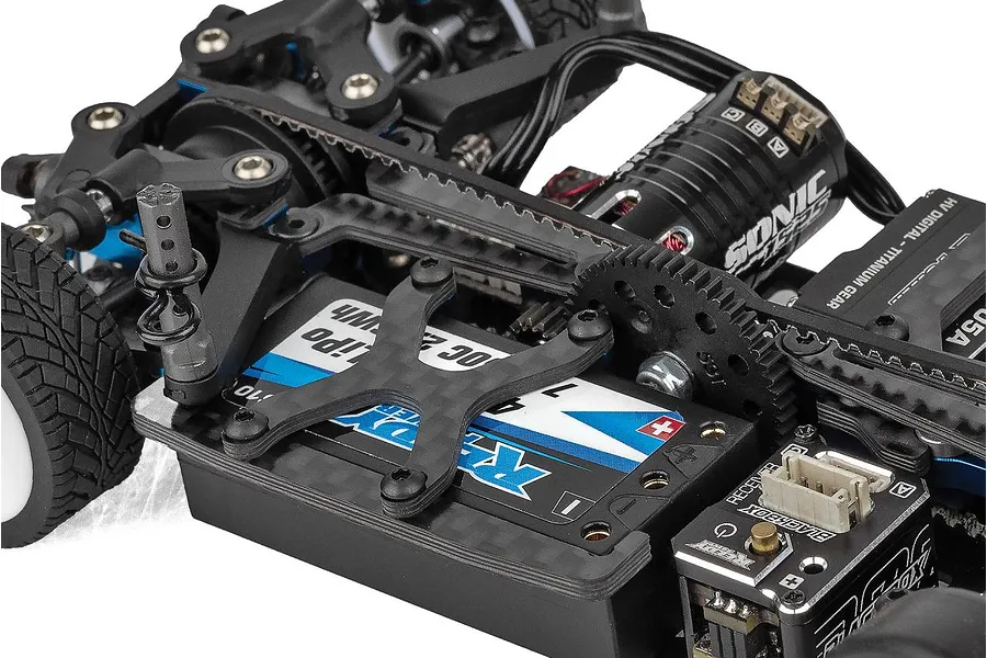 Close-up of the chassis of a Team Associated TC28 RC car showing the battery, motor, and internal components.
