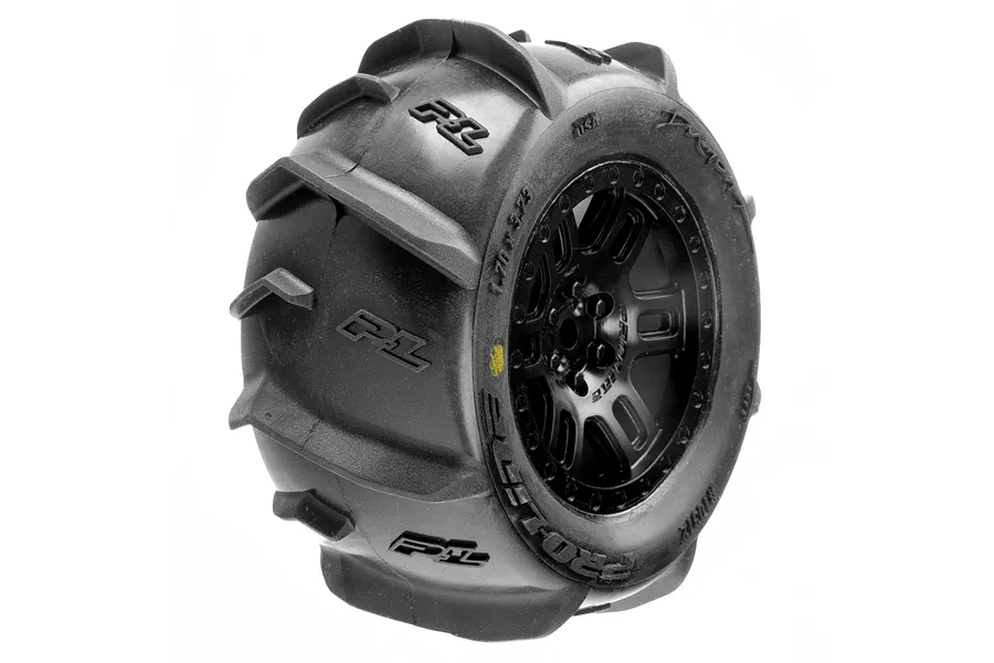 A single Pro-Line Dumont MT paddle tyre mounted on a black split-six RC wheel against a white background.