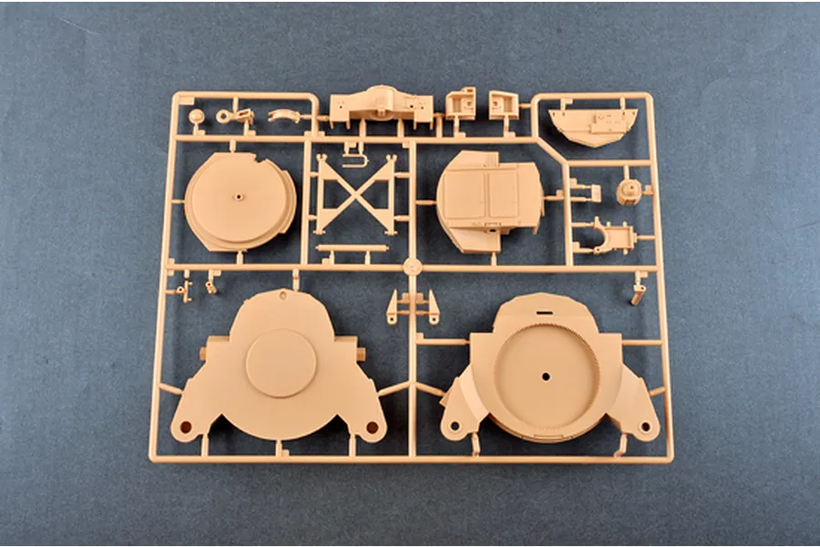 A tan plastic sprue containing various model parts for the I Love Kit 1/16 M198 155mm Towed Howitzer model kit.