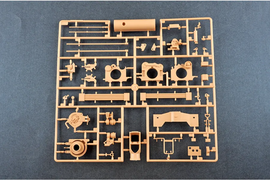 A tan plastic sprue containing various unpainted model parts for an I Love Kit 1/16 scale M198 155mm Towed Howitzer model kit.