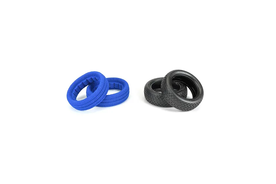 Two black Pro-Line 2.2 inch RC buggy front tyres and two blue foam inserts arranged on a white background.