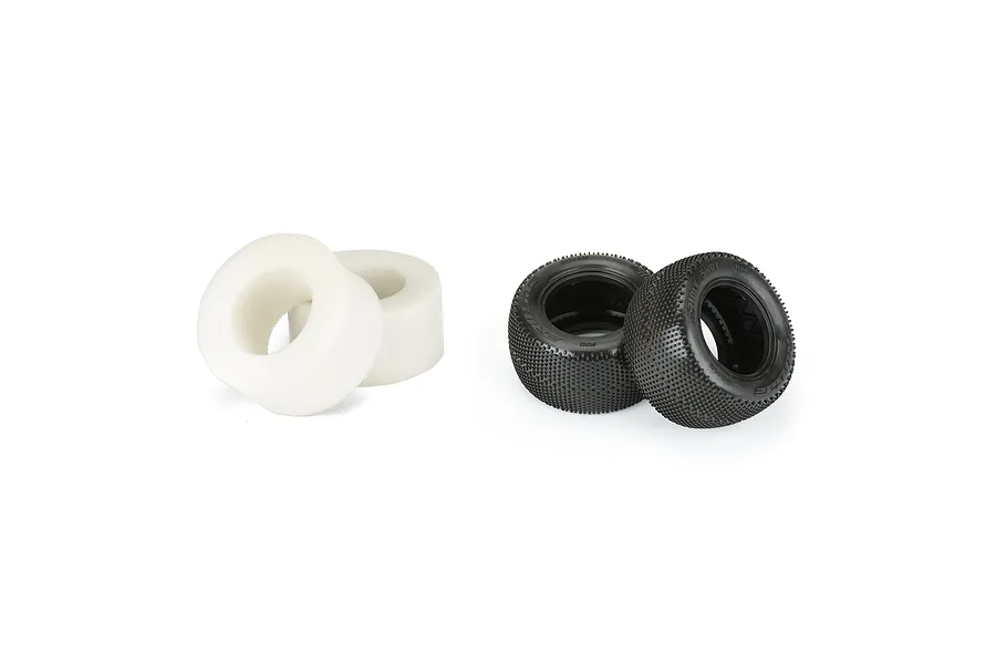 Two black Pro-Line Hole Shot 2.0 RC stadium truck tyres and two white foam inserts on a white background.