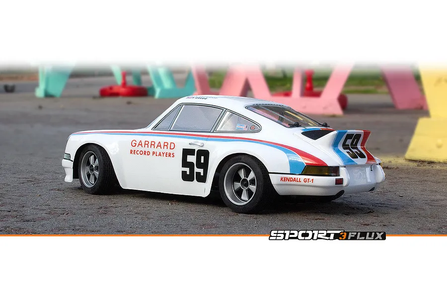 HPI Sport 3 Flux 1973 Brumos Porsche Carrera RSR RC car in white with racing livery, number 59, parked on asphalt.