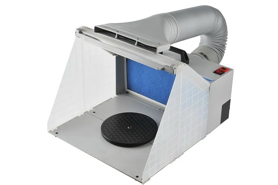A portable Hseng airbrush spray booth with a folding translucent hood, a black rotating turntable, and an exhaust hose attached to the back.