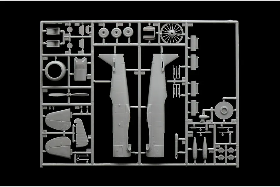 A grey plastic sprue containing various model aircraft parts for an Italeri 1/48 T-6G Texan kit, including fuselage halves, engine, and propeller.
