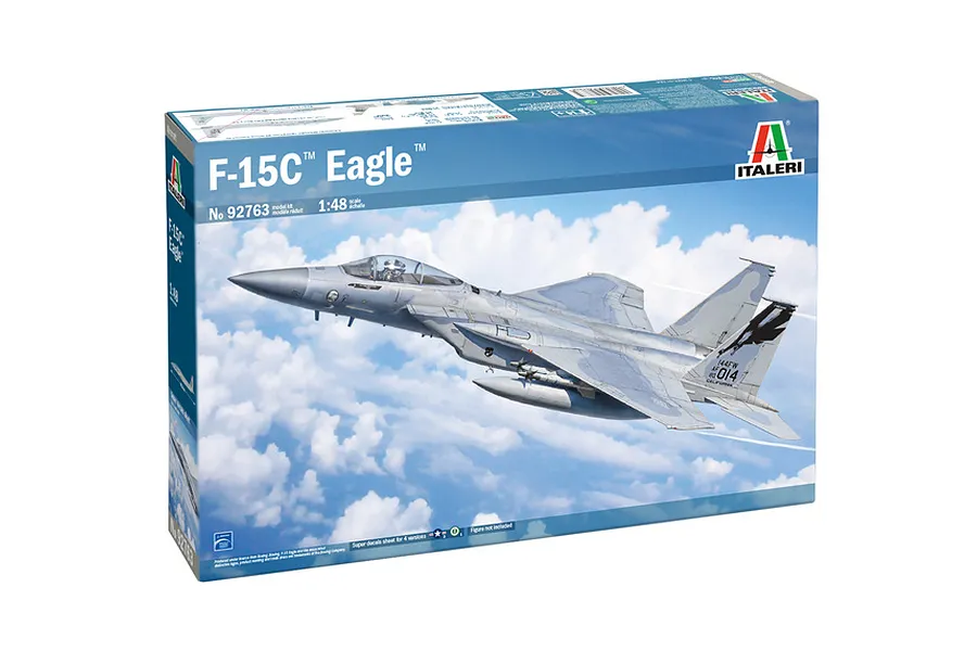 The packaging for an Italeri 1/48 scale F-15C Eagle plastic model kit, featuring an illustration of the fighter jet flying through a cloudy sky.