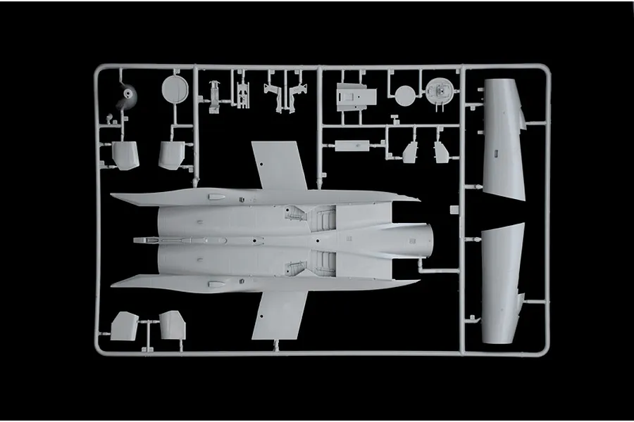 A grey plastic sprue from an Italeri 1/48 scale F-15C Eagle model kit, showing the main fuselage and various smaller aircraft components.