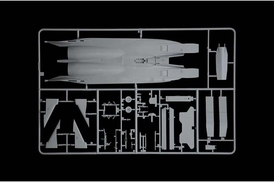 A grey plastic sprue from an Italeri 1/48 F-15C Eagle model kit, showing the main fuselage and various smaller aircraft components.