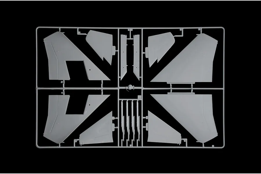 A grey plastic model kit sprue containing various aircraft wing and tail components for an F-15C Eagle model.