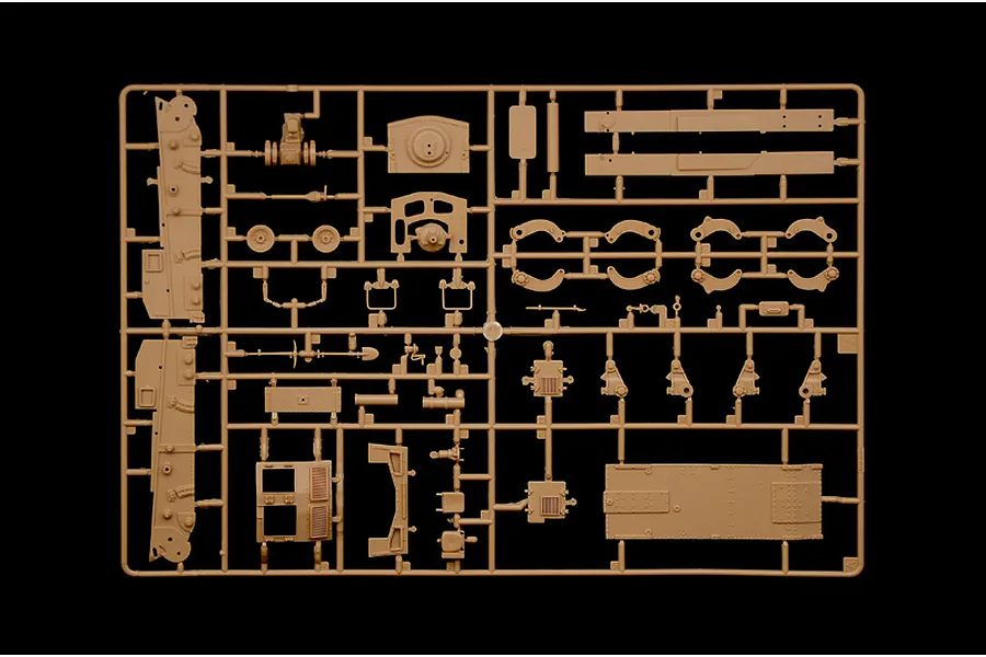 A tan plastic sprue containing various unpainted model tank parts for an Italeri 1/35 scale L6/40 model kit.