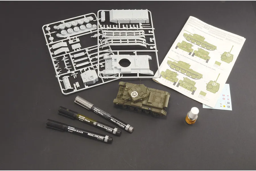 Italeri 1/56 Cromwell Mk.IV model kit contents including plastic sprues, a painted tank model, three paint markers, glue, decals, and instructions.