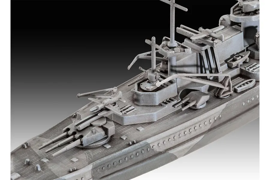 Close-up of a 1/1200 scale plastic model of the Gneisenau battleship, showing the deck, gun turrets, and superstructure details.