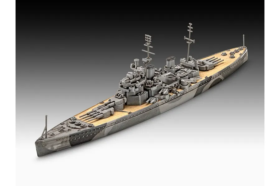 A high-angle studio shot of a completed 1/1200 scale plastic model of the HMS Duke of York battleship, featuring a grey camouflage hull and tan deck.