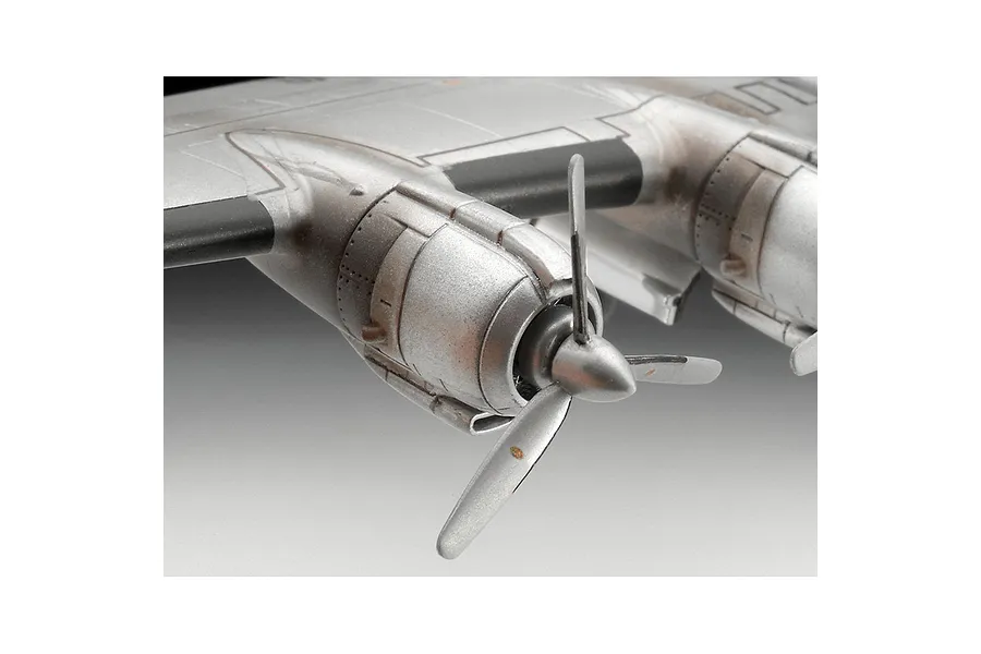 Close-up of the silver engine nacelles and three-bladed propeller on a Lockheed Super Constellation model aircraft.