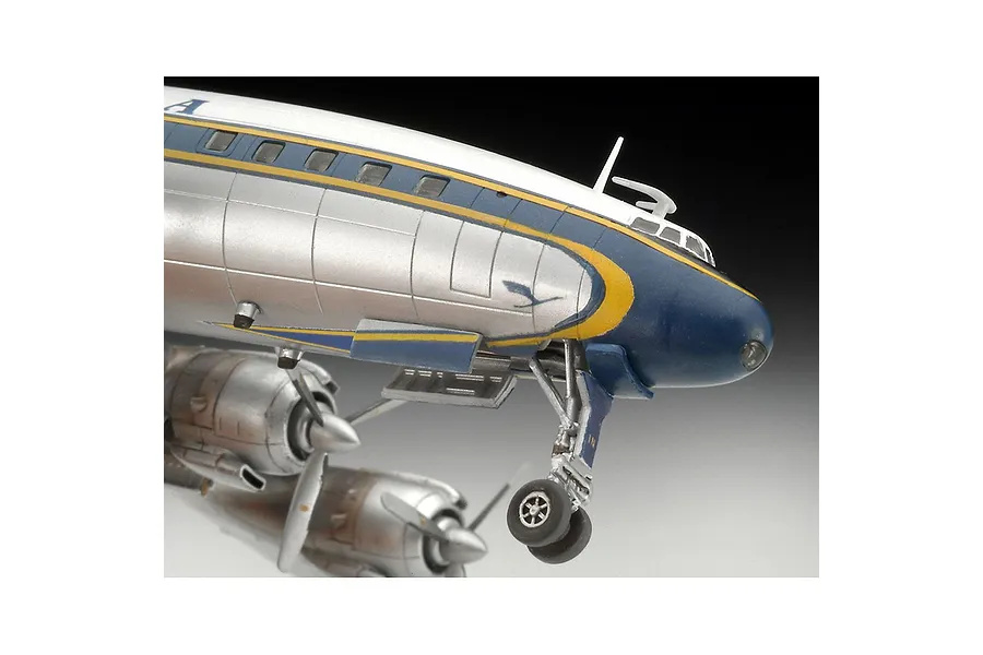 Close-up of a painted plastic model Lockheed Super Constellation aircraft showing the nose, cockpit, and landing gear.