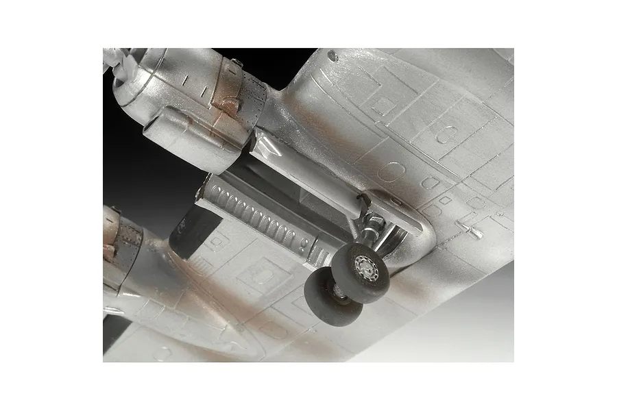 Close-up of the landing gear and wing section of a silver painted Lockheed Super Constellation plastic model kit.