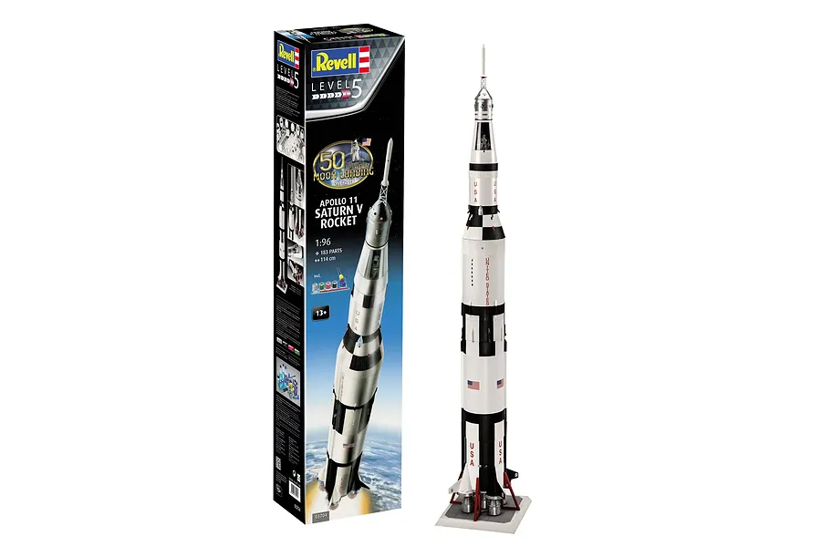 Revell 1/96 scale Apollo 11 Saturn V rocket plastic model kit box standing next to the fully assembled and painted model on a display stand.