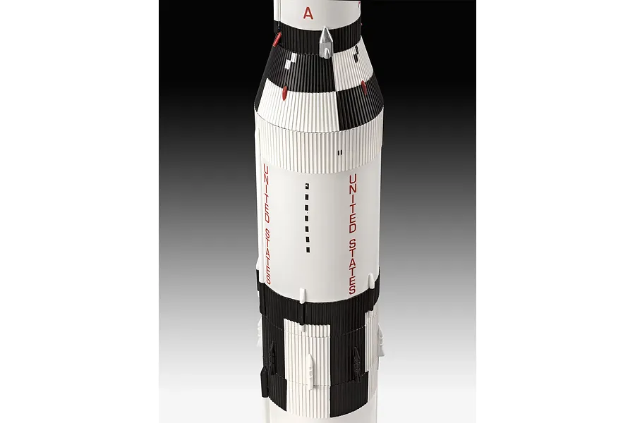 A close-up view of a Revell 1/96 scale Saturn V rocket model, showing the white and black cylindrical body with United States lettering.