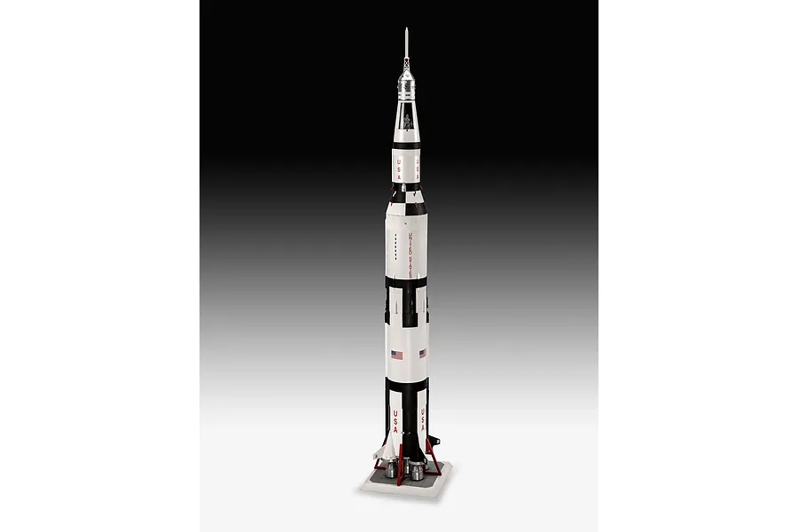 A fully assembled 1/96 scale plastic model of the Apollo 11 Saturn V rocket standing vertically on a display base against a gradient background.