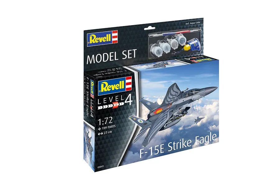 Revell 1/72 scale F-15E Strike Eagle plastic model kit box showing the finished aircraft in flight, including paint, glue, and a brush.
