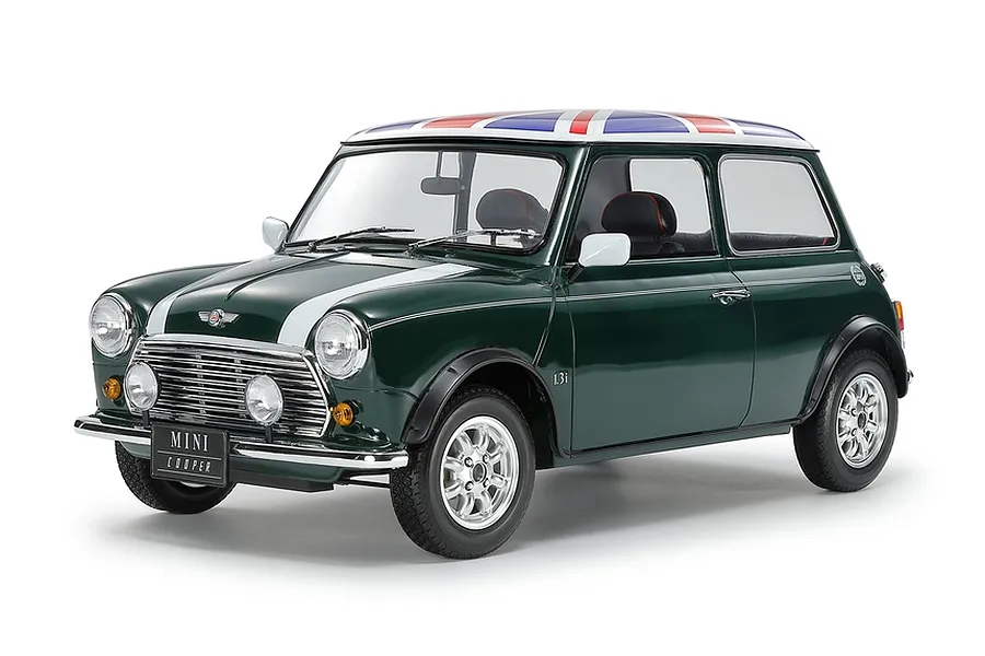 A fully assembled 1/12 scale Tamiya Mini Cooper 1.3i model car painted British racing green with a Union Jack roof design on a white background.