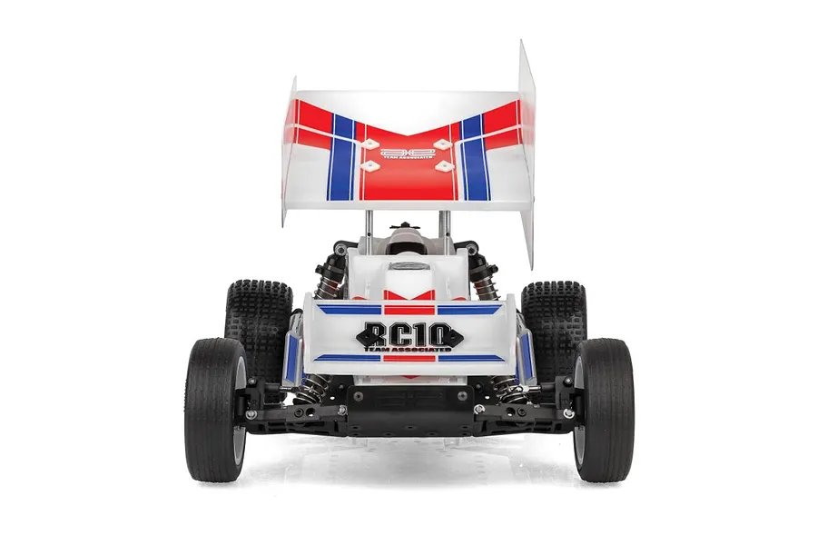 Rear view of a Team Associated RC10 Sprint RC car featuring a large white wing with red and blue racing stripes and RC10 branding.