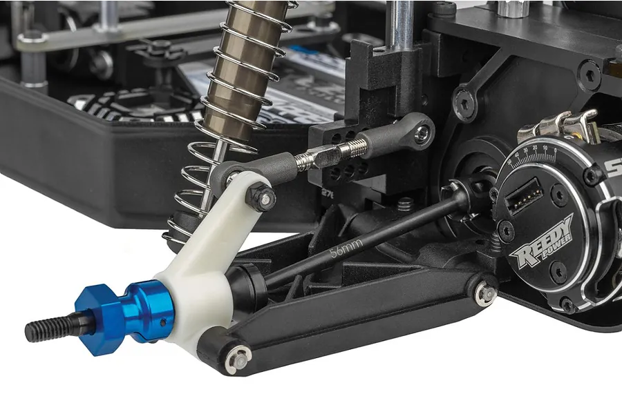 Close-up of the rear suspension and drivetrain assembly on a Team Associated RC10 Sprint RC car, featuring a Reedy Power motor and blue anodized wheel hex.