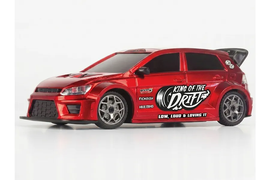 A red BlackZon Myte 1/43 scale RC drift car viewed from the side, featuring King of the Drift decals on the door.