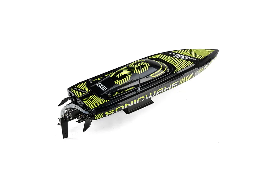 A high-angle studio shot of the Pro Boat Sonicwake V3 RC speed boat in black with yellow geometric patterns.