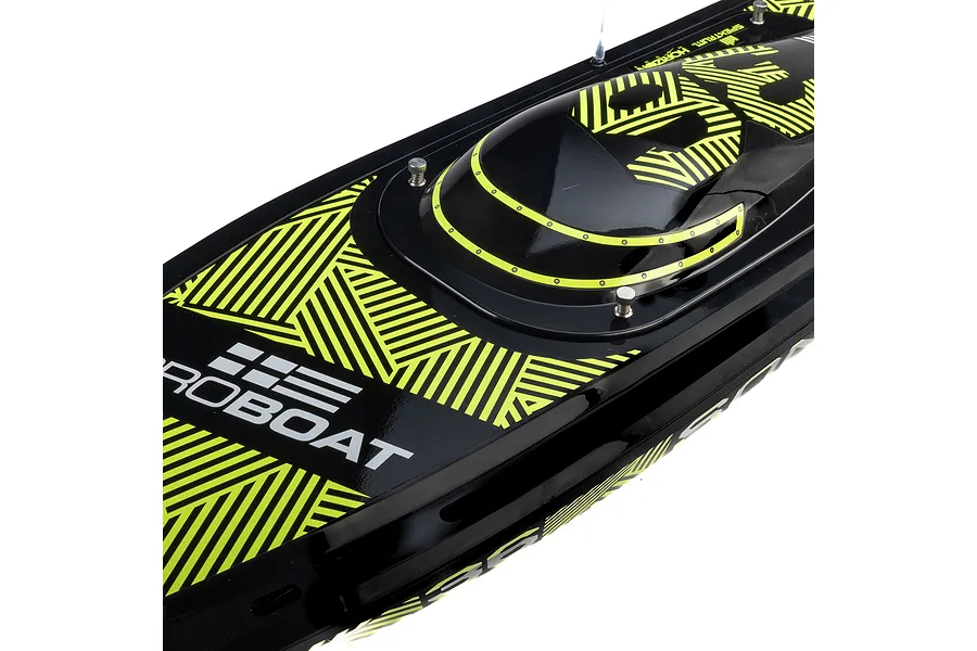 Close-up of the black and neon yellow deck of a Pro Boat Sonicwake V3 RC boat, showing the hatch and branded graphics.