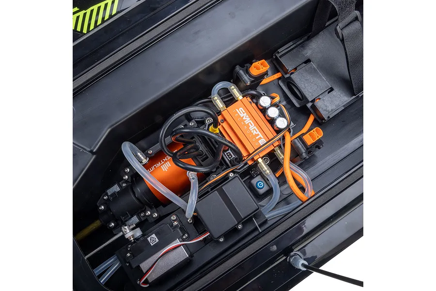 Internal view of the Pro Boat Sonicwake V3 RC boat showing the orange brushless motor, ESC with Smart Technology branding, and water cooling tubing.